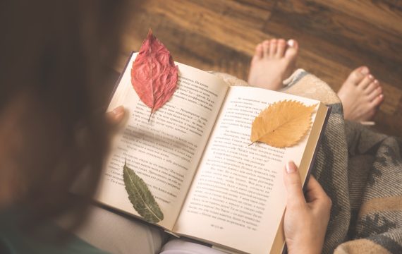 young-girl-book-with-autumn-leaves